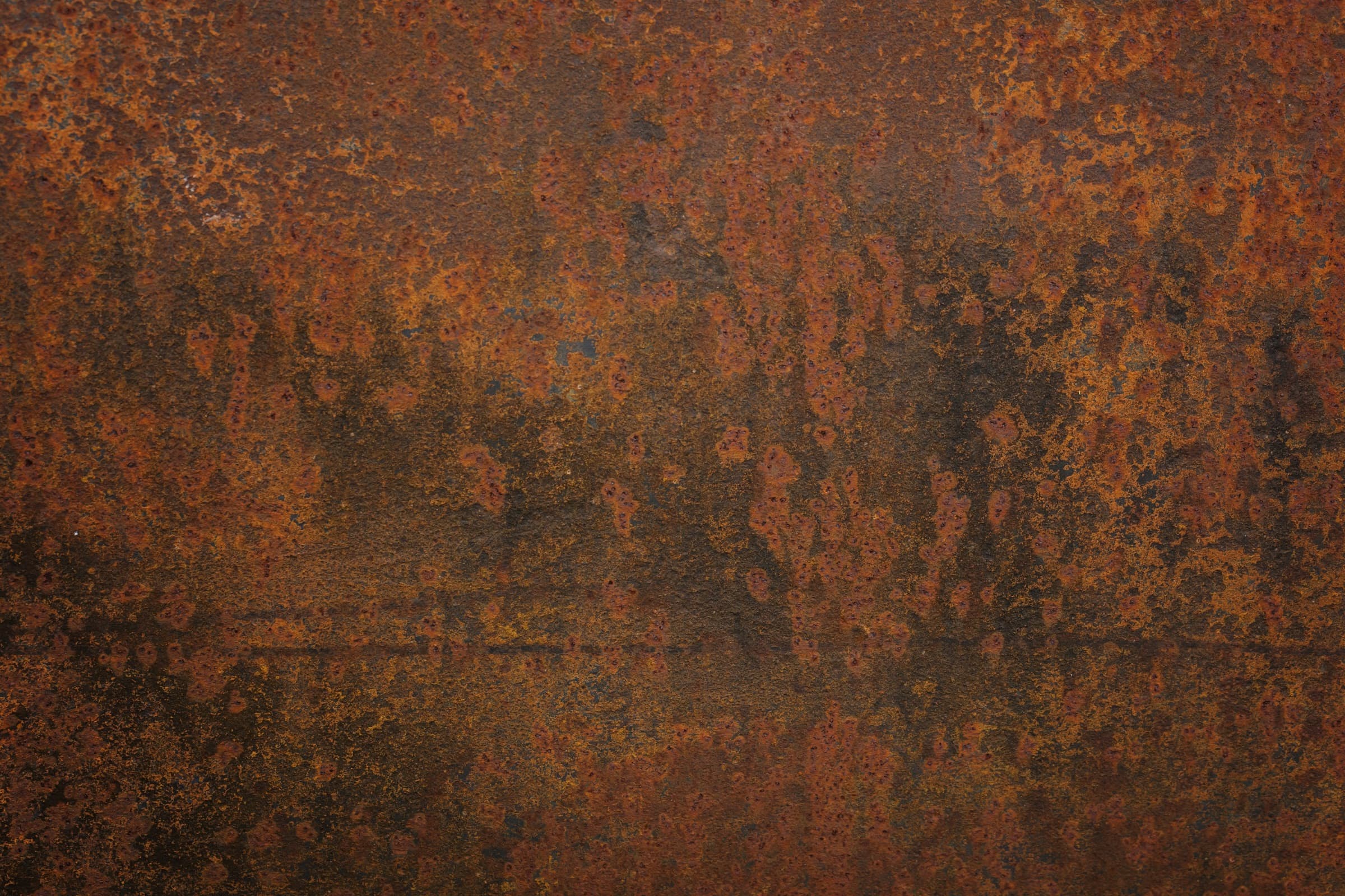Heavily oxidized, corroded metal surface, close up