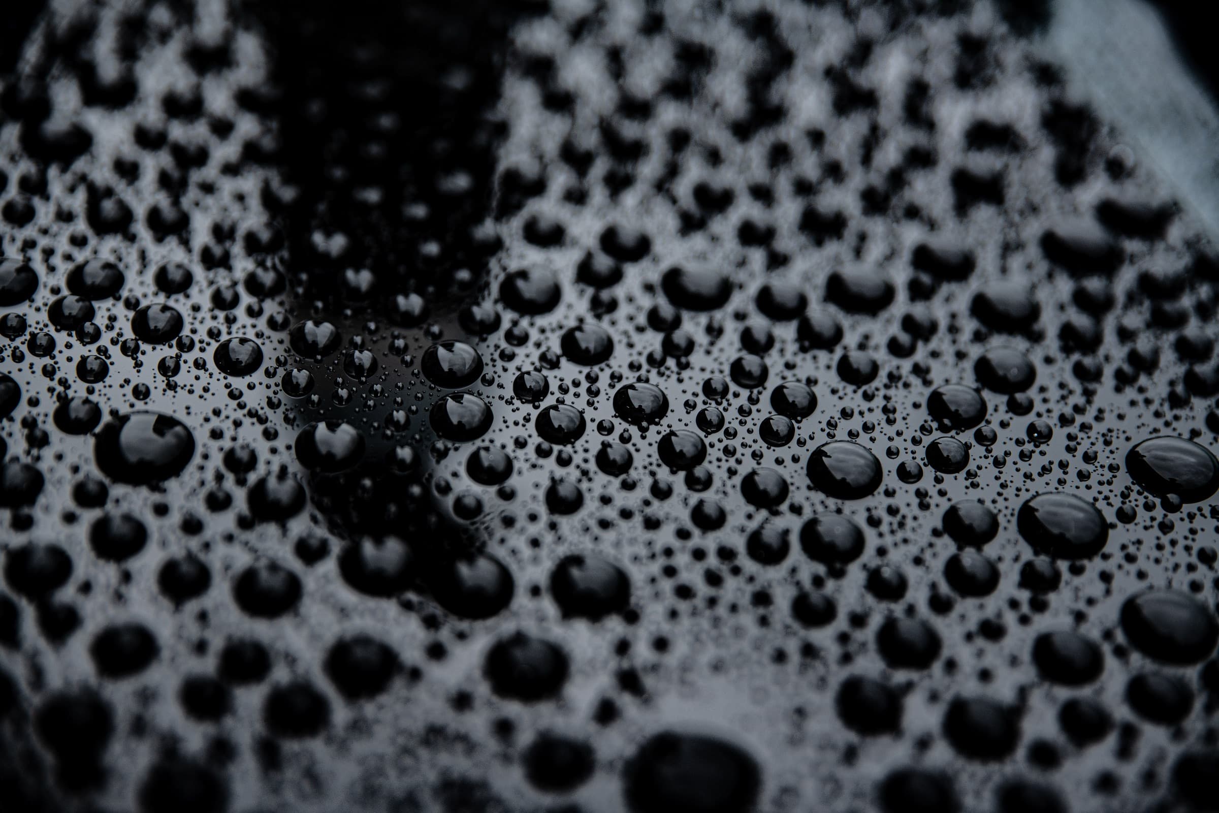 Water beading tightly on a sealed, coated panel after rain